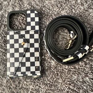 Bandolier Monochrome Checkered Phone Case with Strap in great condition